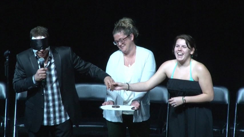 Randy, blindfolded on the stage.