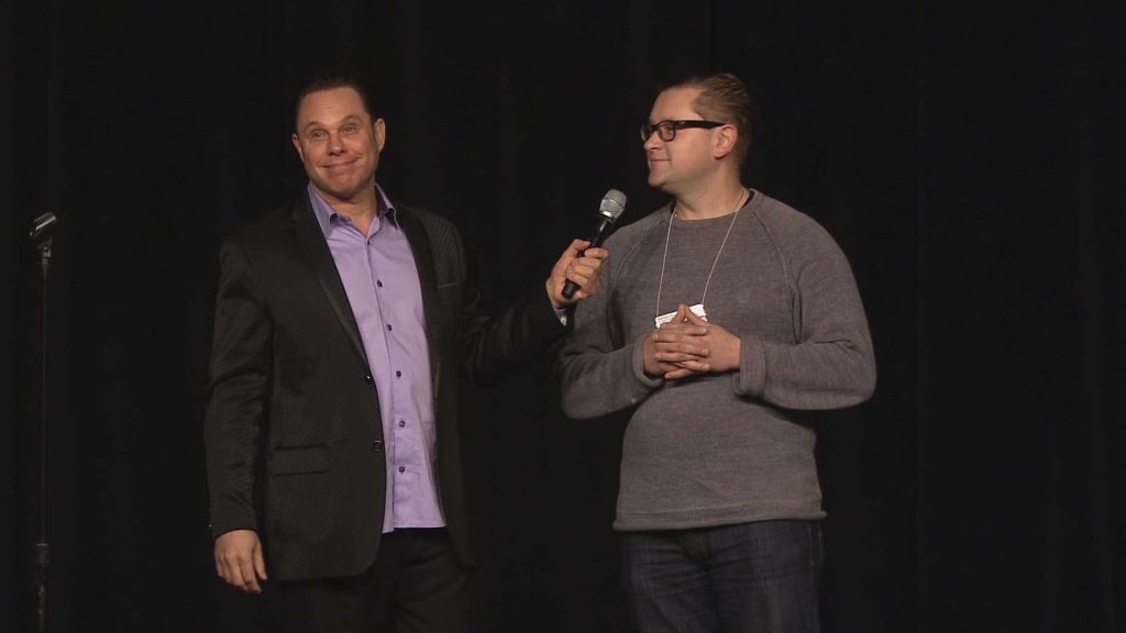 Randy speaking to an audience member on one his show.