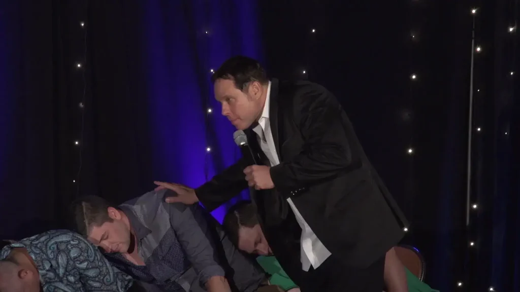 Randy Charach Magician performing with audience participants.